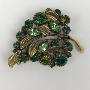 1950s Gold Tone Emerald Colored Leaf Pronged Crystal Brooch Made in Austria